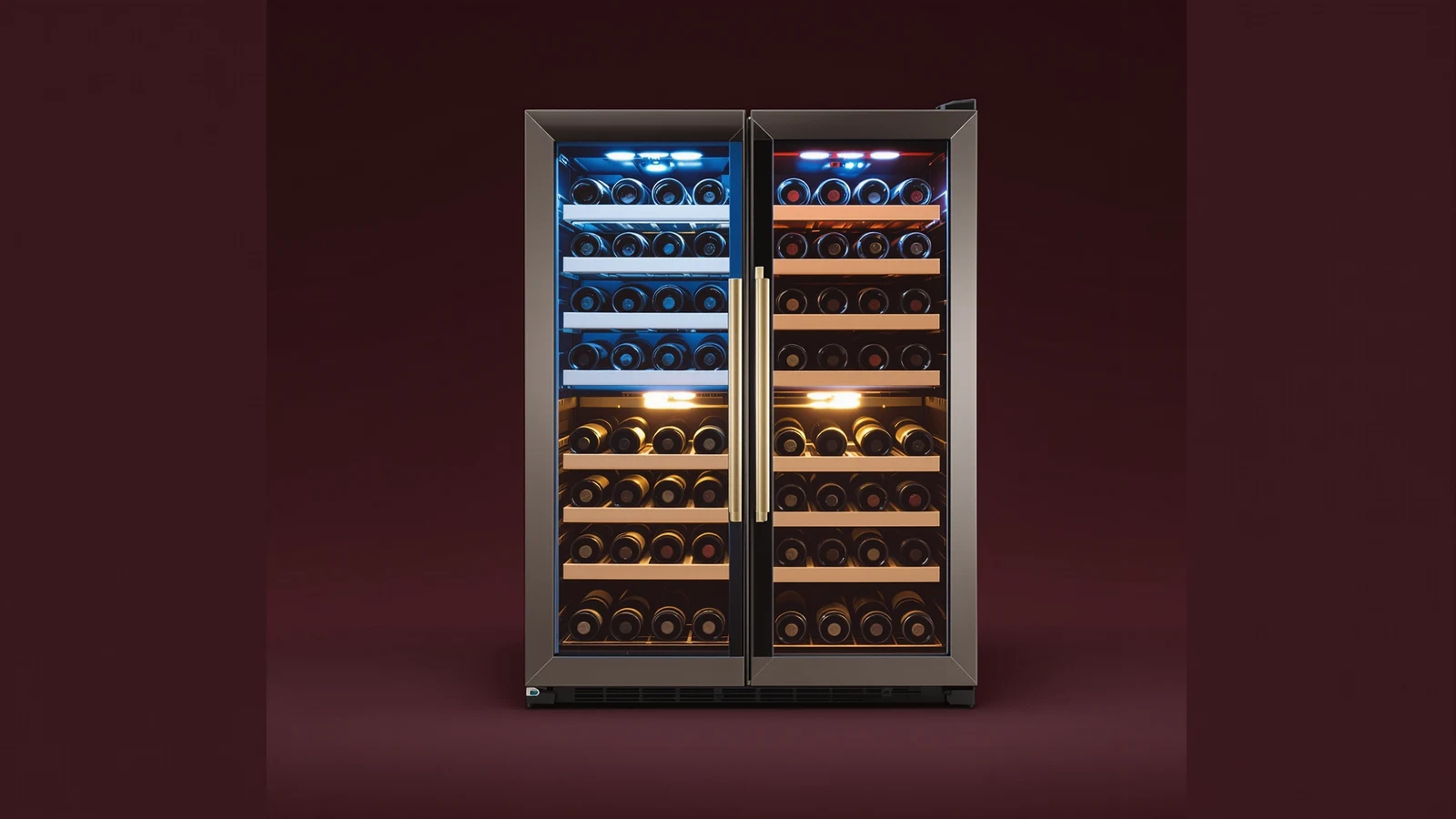 A dual zone wine refrigerator with two separately lit compartments, red wine bottles above and white wine bottles below